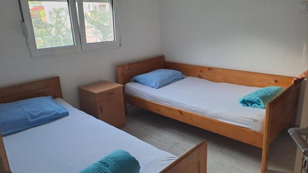 Postel nebo postele na pokoji v ubytování Spasic Apartments Sutomore