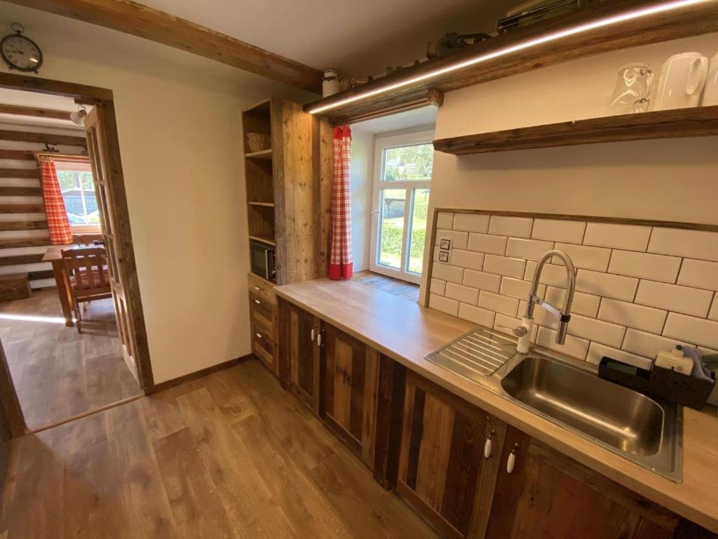 Kuchyň nebo kuchyňský kout v ubytování Apartmány u Dostálů