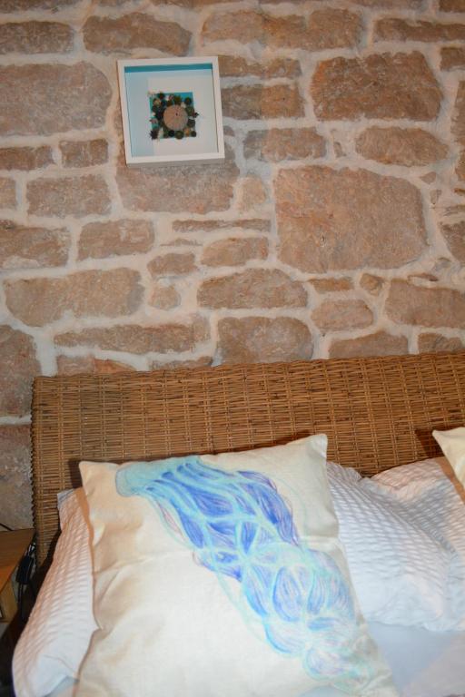 Postel nebo postele na pokoji v ubytování VILLA MOST Tisno