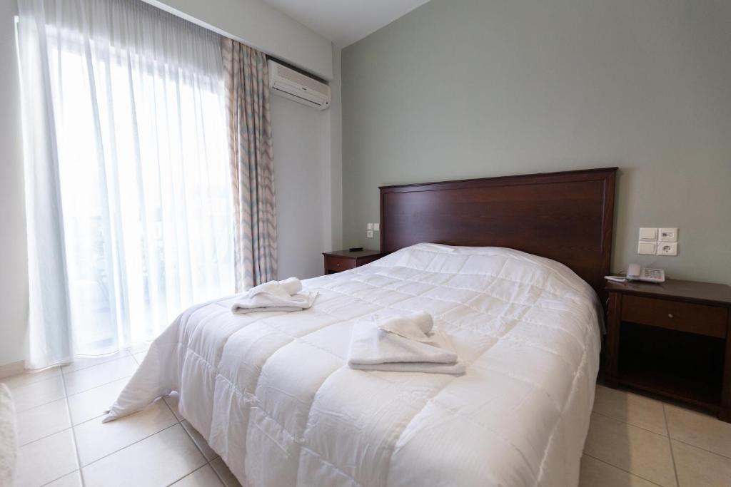 Posteľ alebo postele v izbe v ubytovaní Evita's Resort