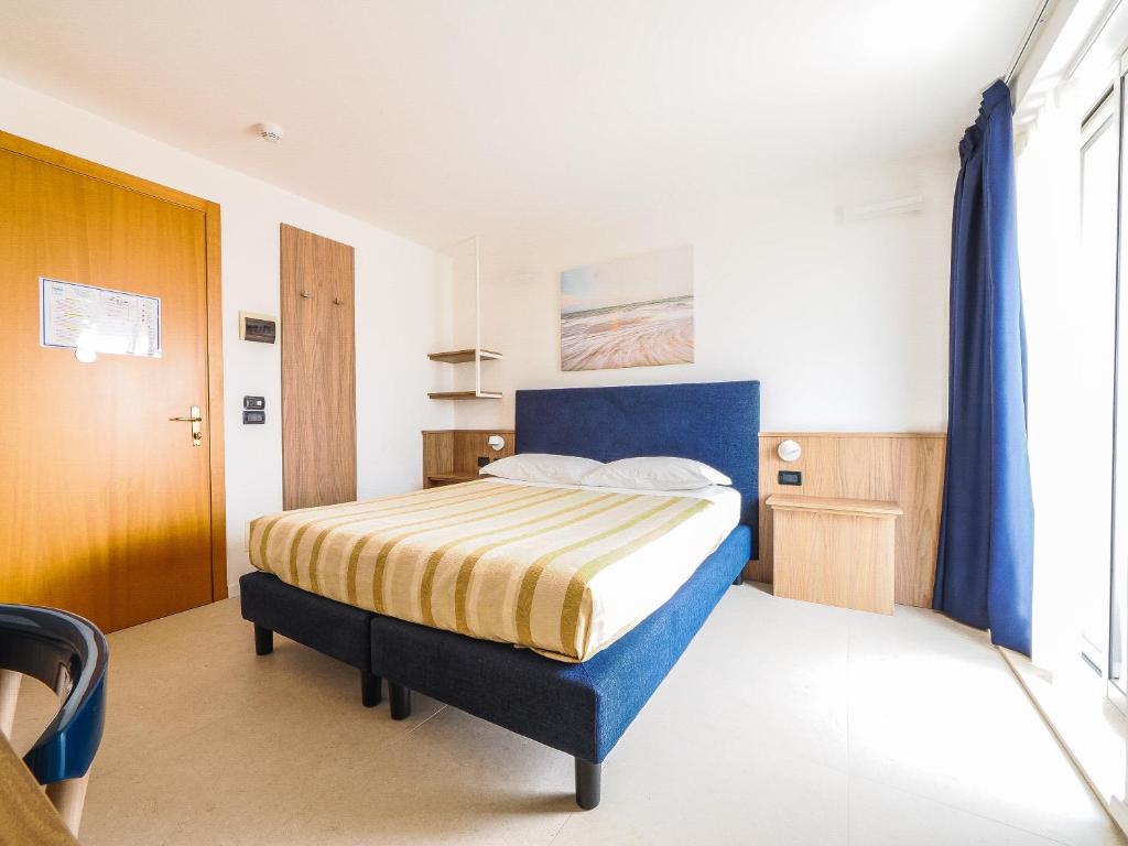 Postel nebo postele na pokoji v ubytování Hotel Angelo