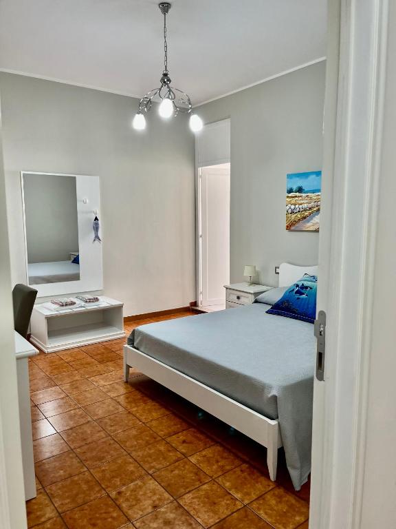 Postel nebo postele na pokoji v ubytování Le Stanze di Lucia vicino Ospedale Cardinale Panico a Tricase