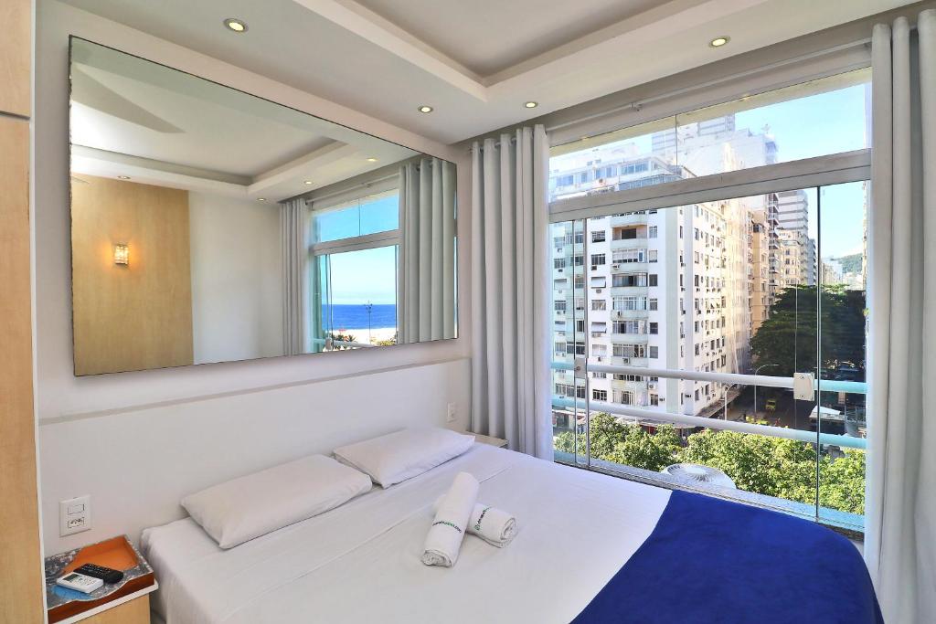 Кровать или кровати в номере Rio Spot Homes Flat C033A