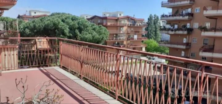 a bridge in front of a city with buildings at MaryHome in Ladispoli