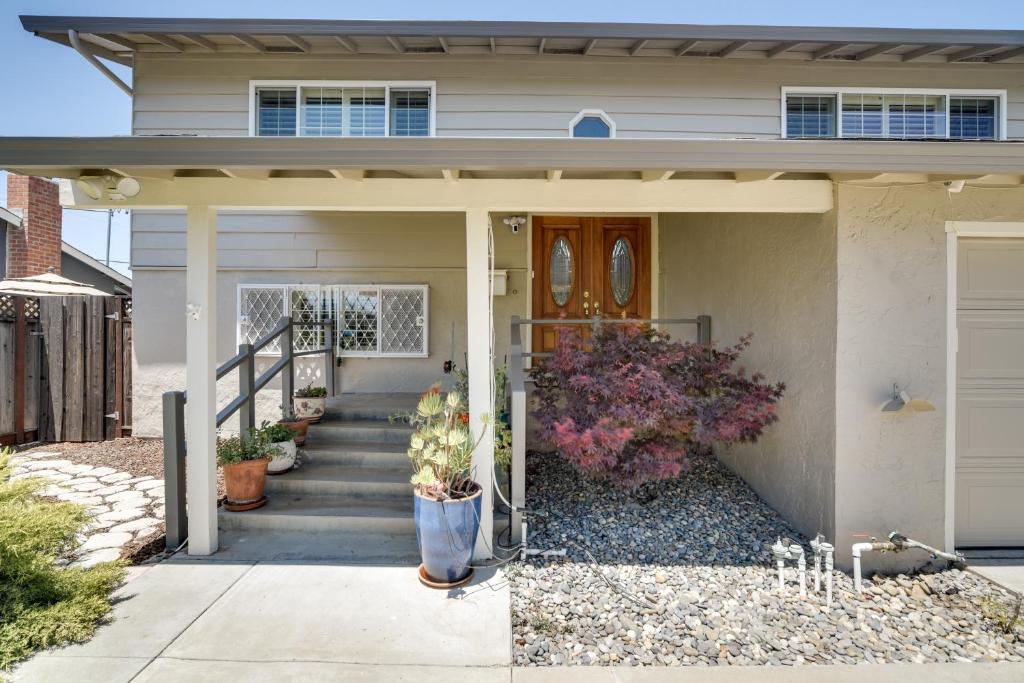 a house with a front door and a porch at Charming San Jose Home with Covered Patio and Backyard in San Jose