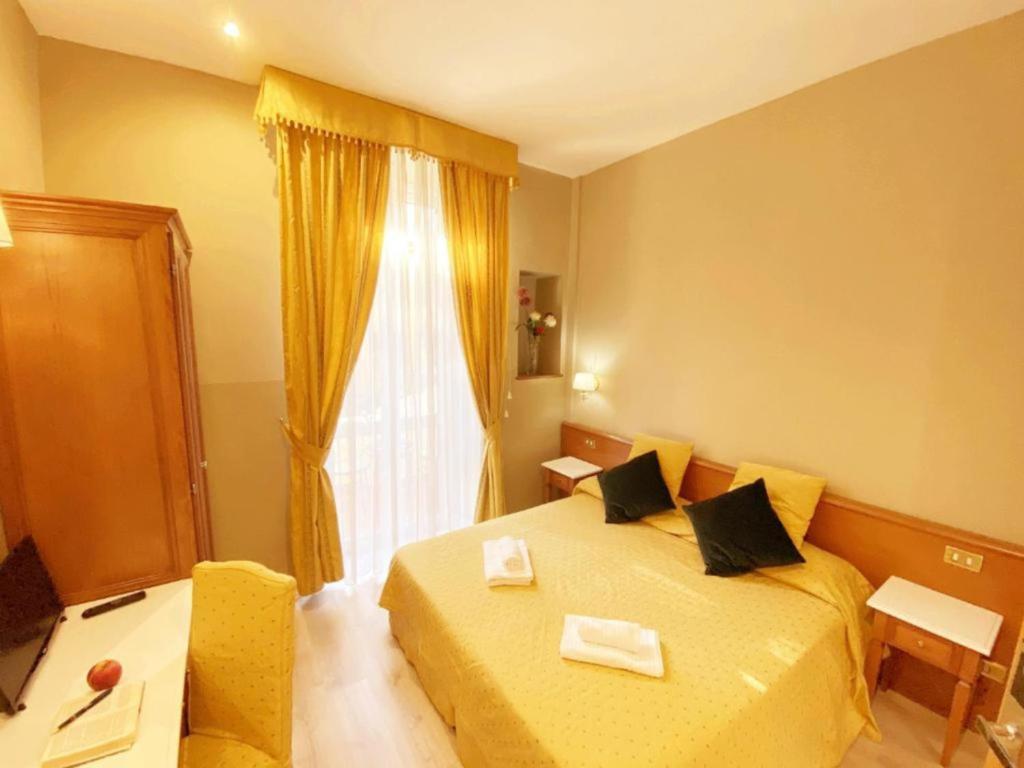 Postel nebo postele na pokoji v ubytování Hotel Giolitti