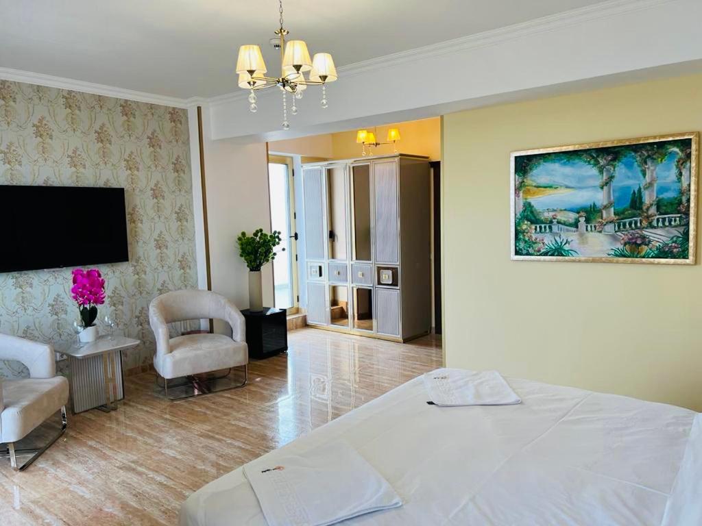 Postel nebo postele na pokoji v ubytování Alessio Hotel Residence