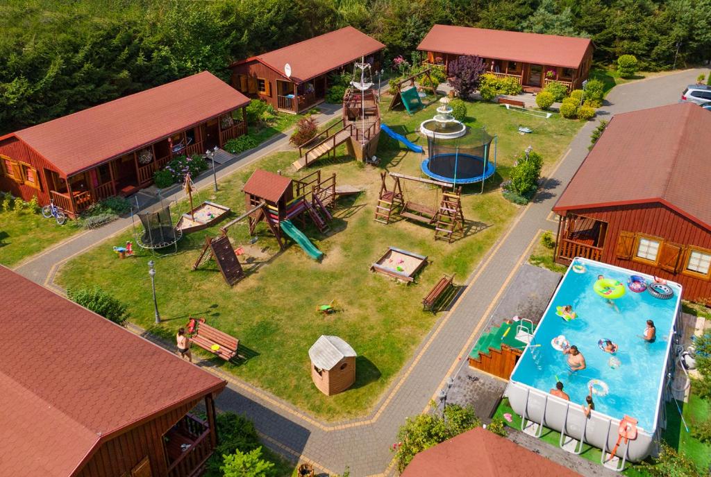 an aerial view of a toy park with a pool at Domki Letniskowe Forest nad morzem in Darłowo