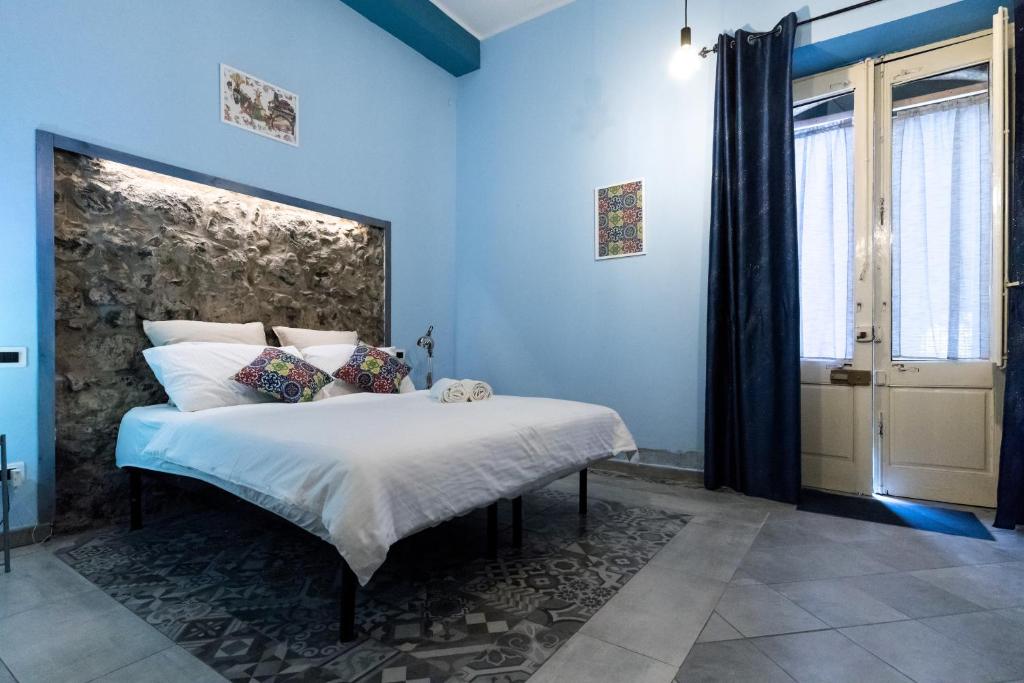 Postel nebo postele na pokoji v ubytování Al Palazzetto di Milo