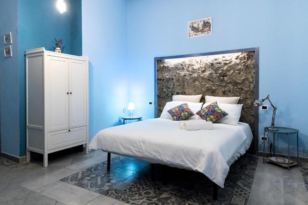 Postel nebo postele na pokoji v ubytování Al Palazzetto di Milo