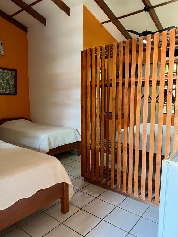 Postel nebo postele na pokoji v ubytování Cabinas El Colibri