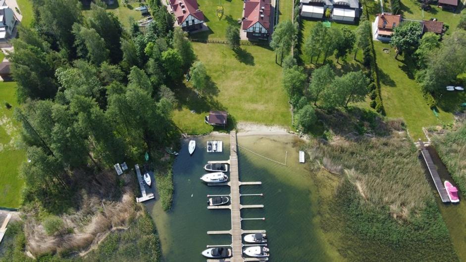 an aerial view of a marina with boats in the water at Ostoja Rydzewo A in Rydzewo