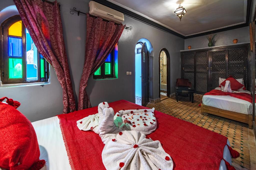 Postel nebo postele na pokoji v ubytování Riad Balkisse