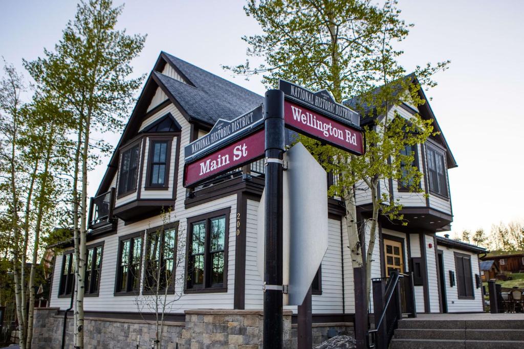 a house with two street signs in front of it at Inn at the Carlin in Breckenridge