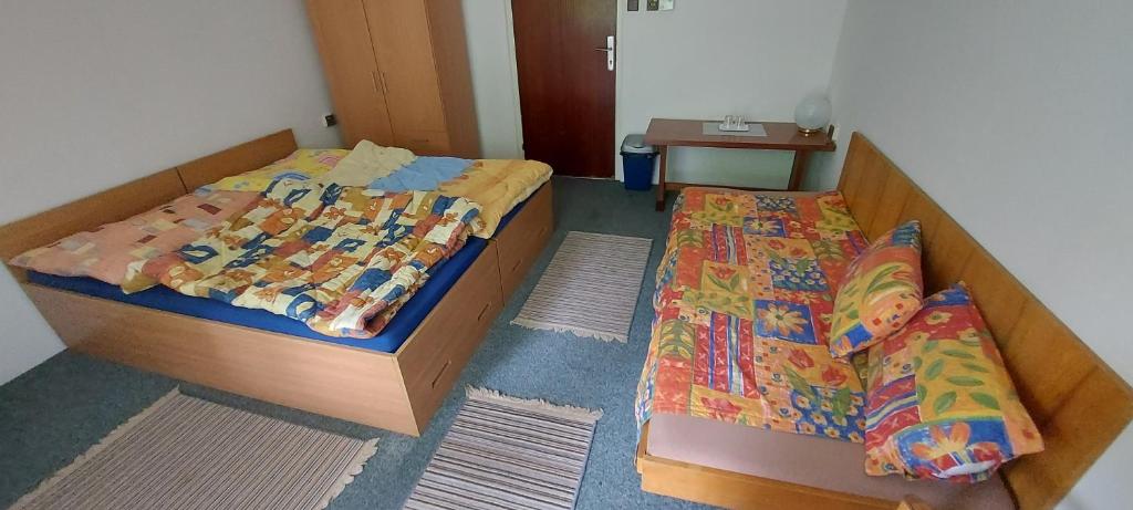 Postel nebo postele na pokoji v ubytování Penzion Svojanov