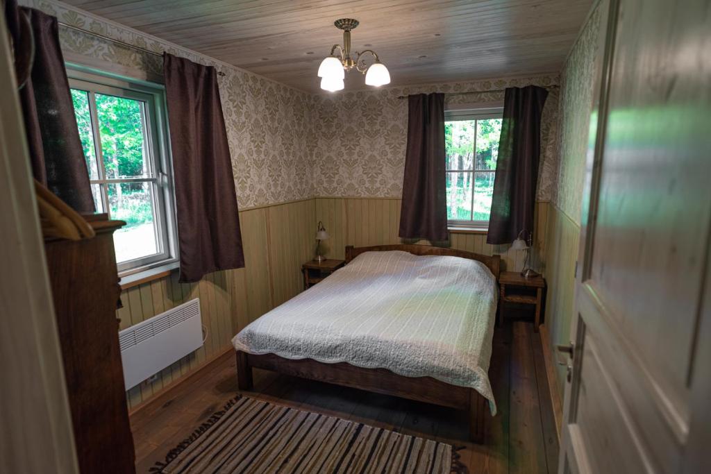 Postel nebo postele na pokoji v ubytování Kernuti House