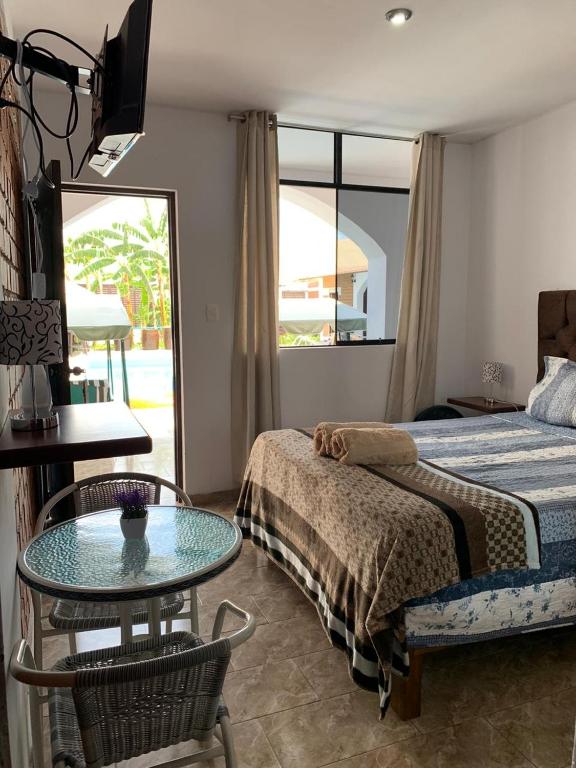 Postel nebo postele na pokoji v ubytování Huacachina Desert House