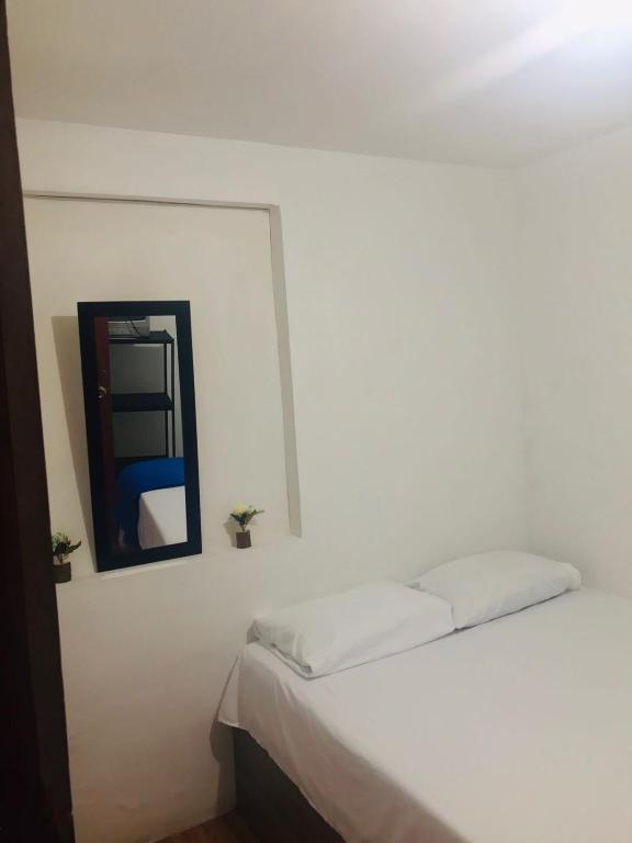 Postel nebo postele na pokoji v ubytování hostal la 18