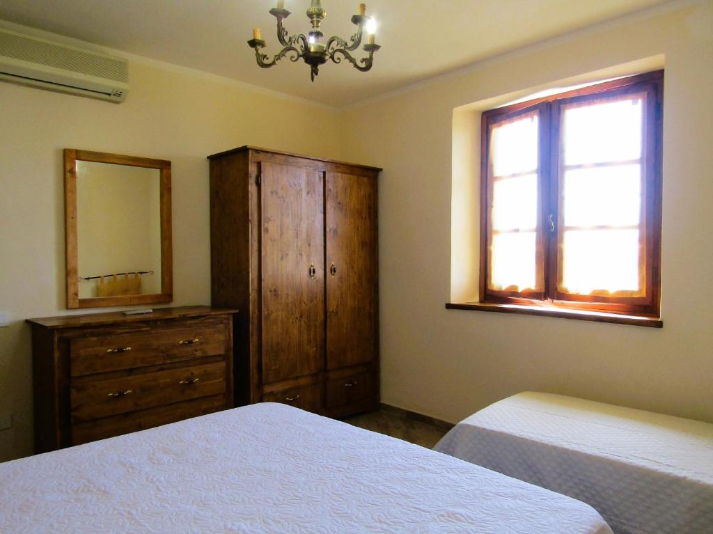 Postel nebo postele na pokoji v ubytování Casina di Desiree e Aurora