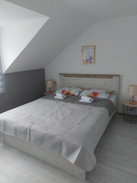 Postel nebo postele na pokoji v ubytování Lučić GUESTHOUSE