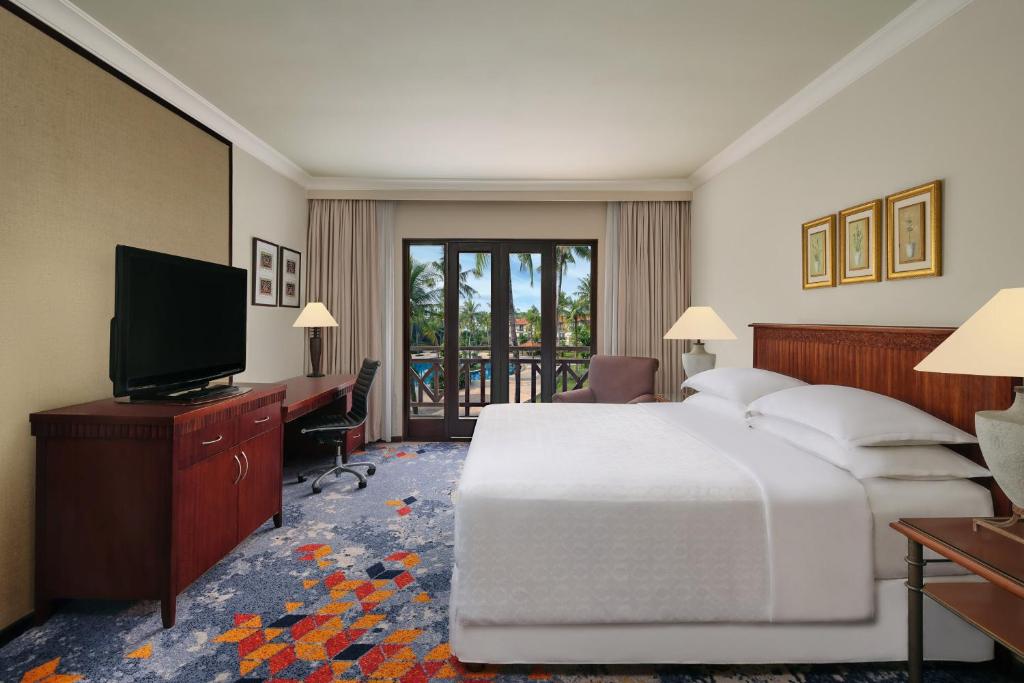 Postel nebo postele na pokoji v ubytování AKAR Hotels & Resort Lampung