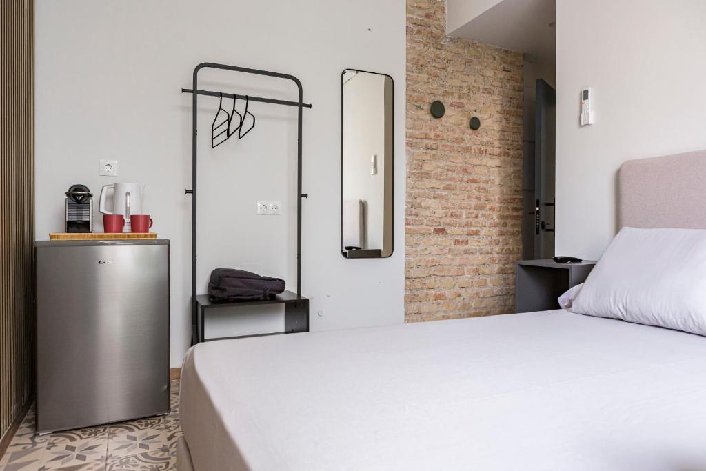Postel nebo postele na pokoji v ubytování Valentin Suites