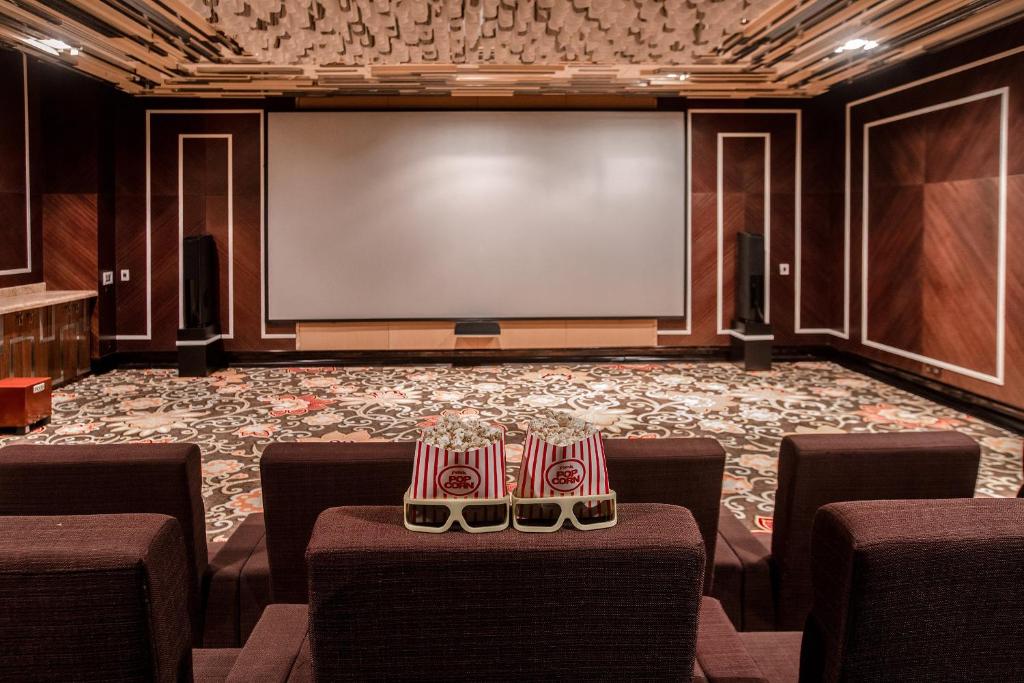 a conference room with chairs and a projection screen at InterContinental Grand Ho Tram in Ho Tram
