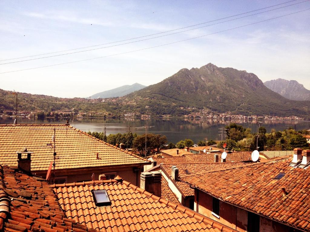 a view of a town with mountains and a lake at B&B Il Cortile in Vercurago