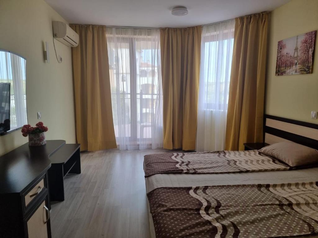 Postel nebo postele na pokoji v ubytování Perla South Beach