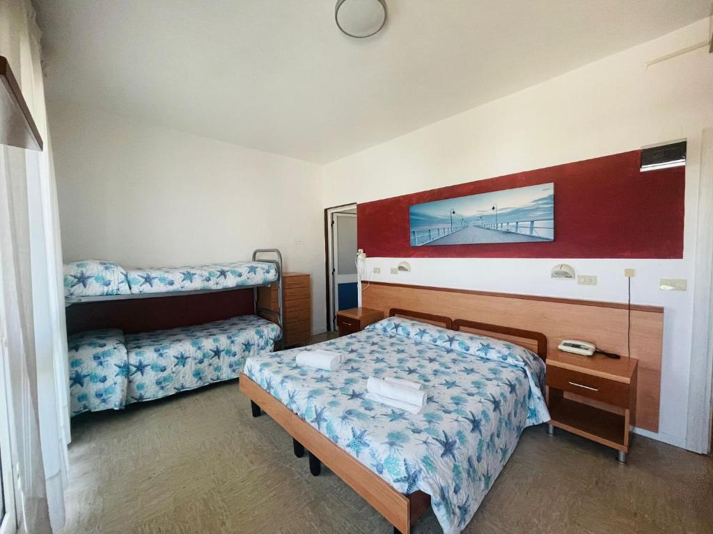 Postel nebo postele na pokoji v ubytování Hotel Vianello