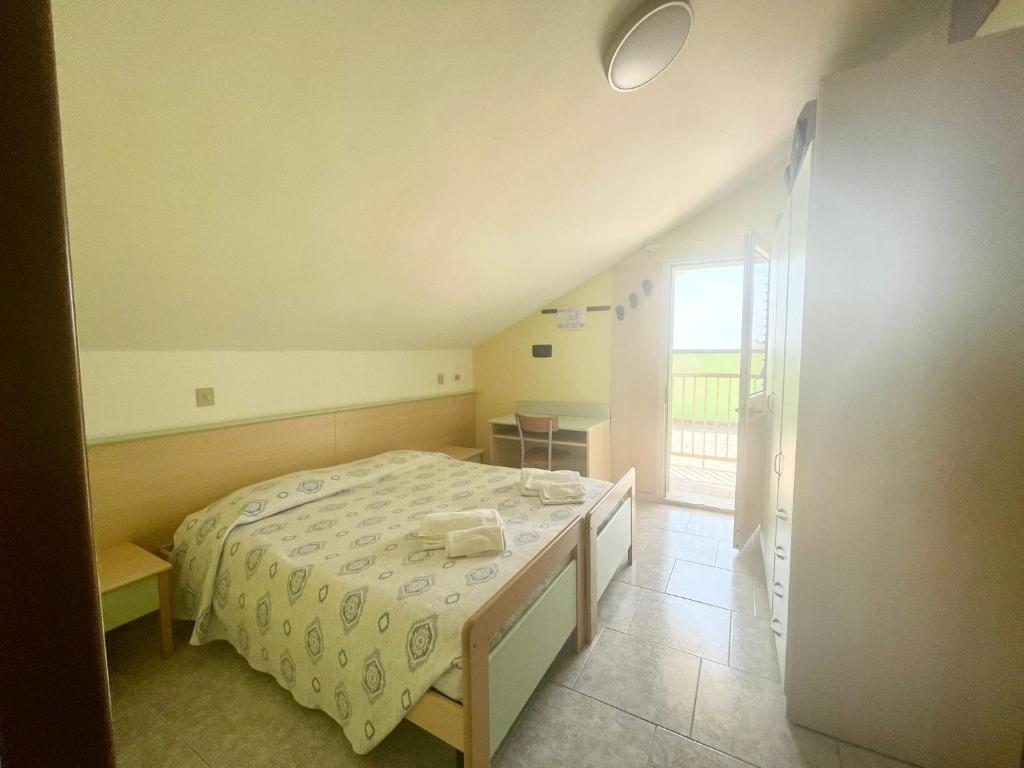 Postel nebo postele na pokoji v ubytování Hotel Vianello