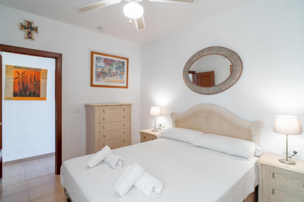 Postel nebo postele na pokoji v ubytování Toboso Torrecilla Beach Paradise