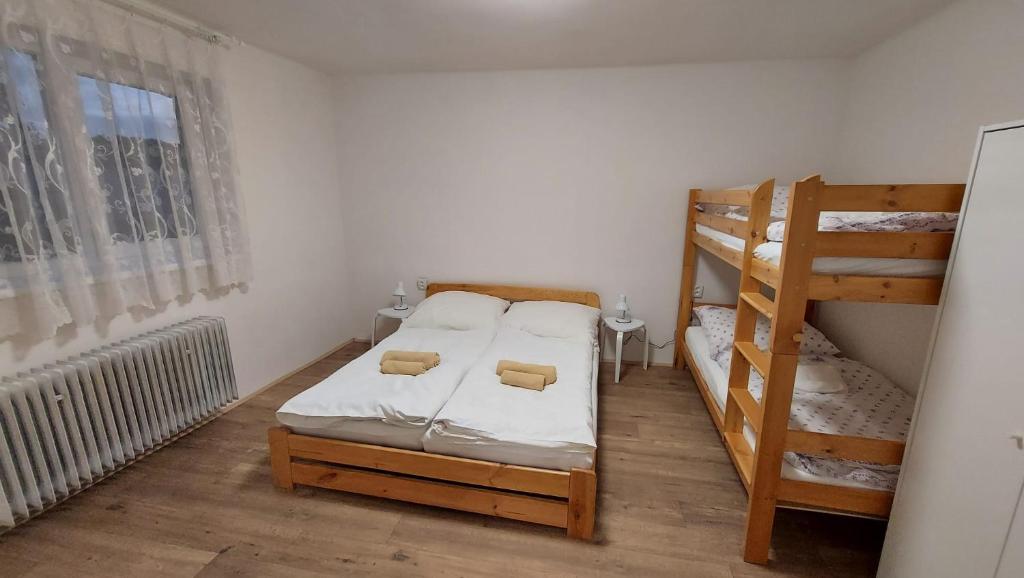 Postel nebo postele na pokoji v ubytování Apartmán Velehrad