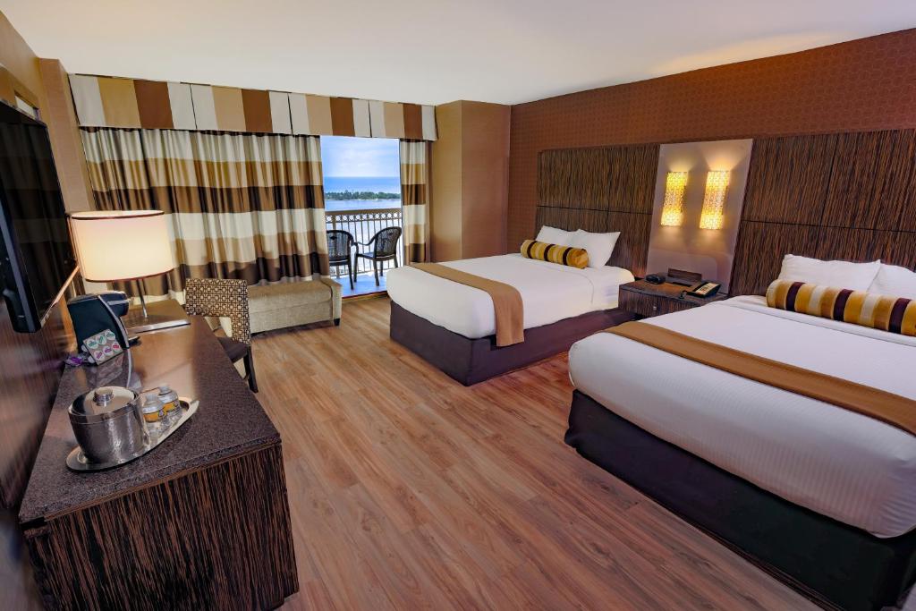Ein Bett oder Betten in einem Zimmer der Unterkunft Golden Nugget Biloxi