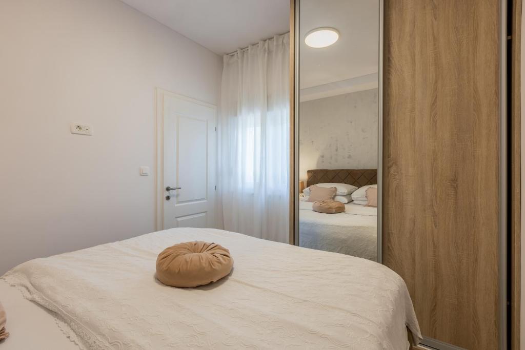 Posteľ alebo postele v izbe v ubytovaní Apartments Milla
