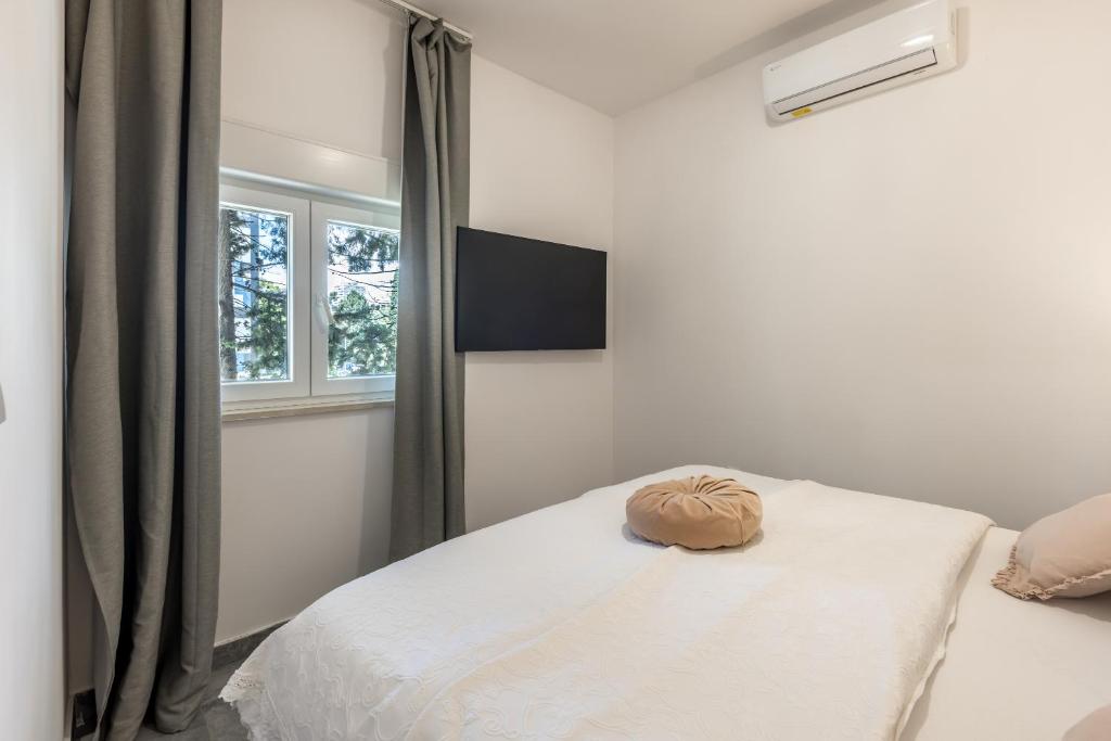 Posteľ alebo postele v izbe v ubytovaní Apartments Milla