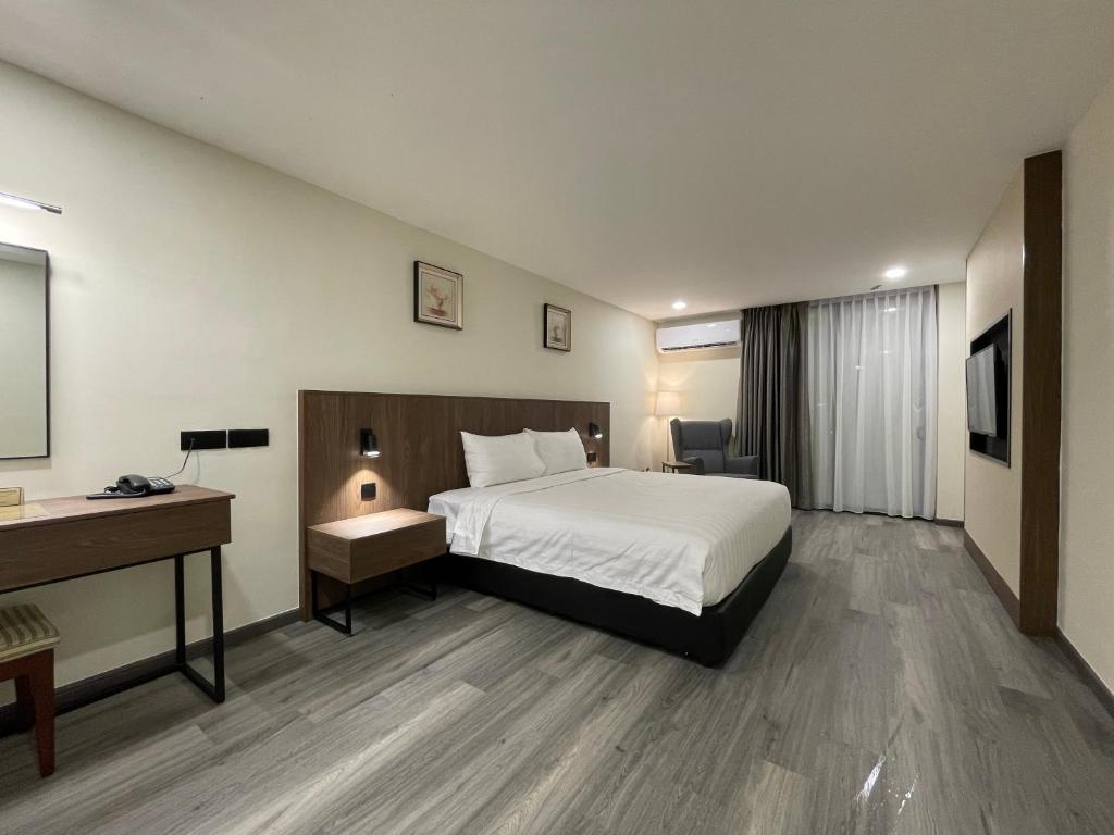Postel nebo postele na pokoji v ubytování Hotel Bundusan