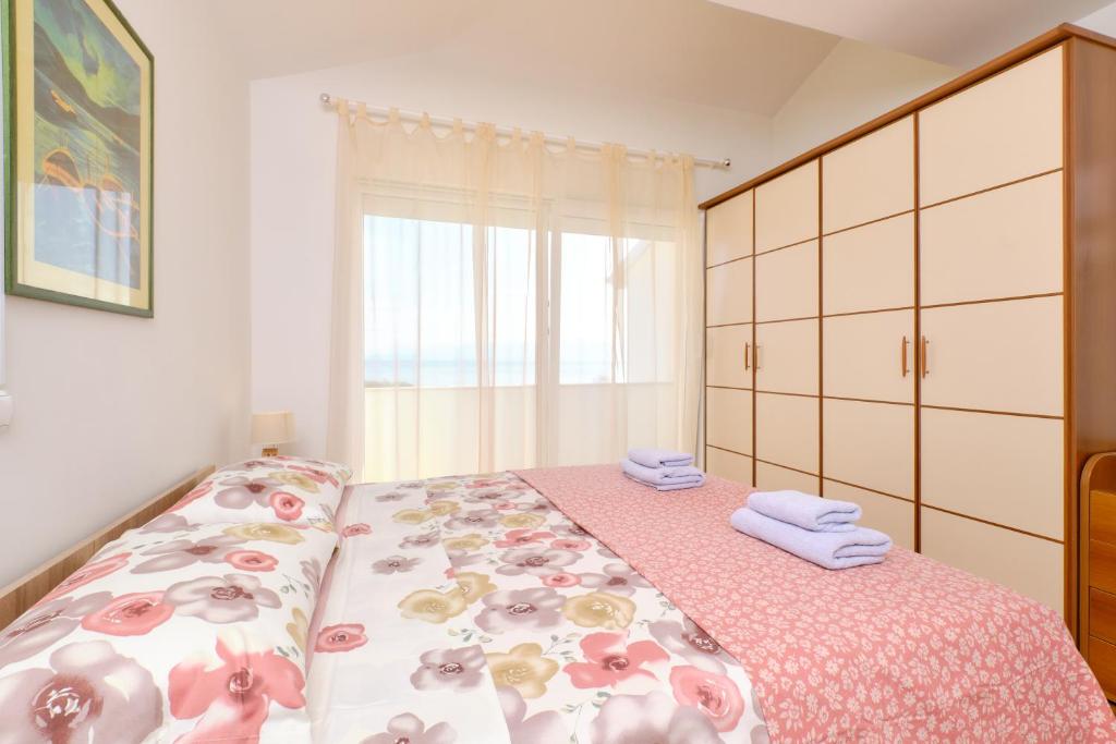 Posteľ alebo postele v izbe v ubytovaní Appartment Ksenija 4