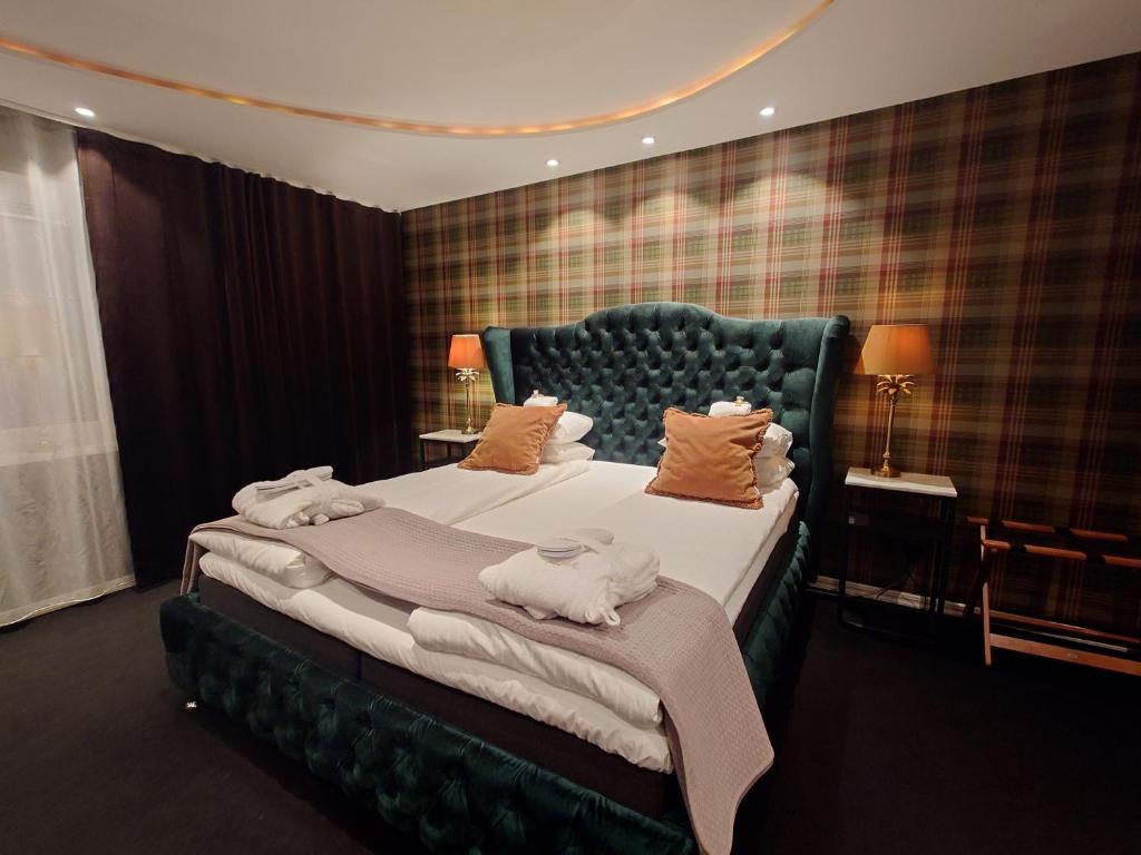 Postel nebo postele na pokoji v ubytování Palace Hotell