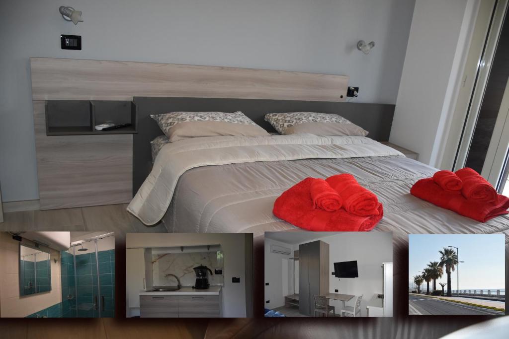 - une chambre avec un lit et des serviettes rouges dans l'établissement B&B Alba Chiara, à Paola