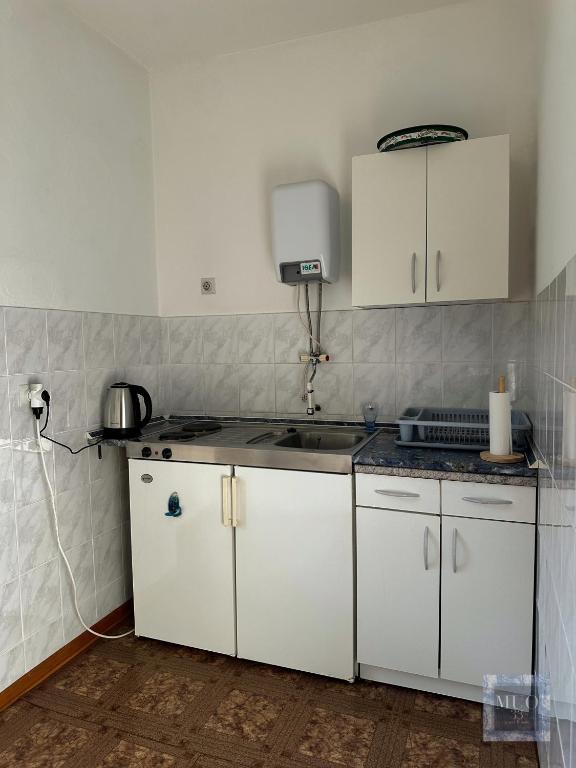 Kuchyň nebo kuchyňský kout v ubytování Muo 33 Apartments