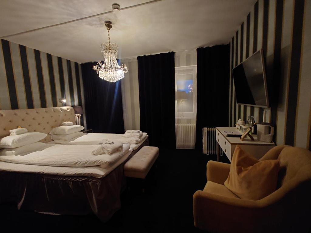 Postel nebo postele na pokoji v ubytování Palace Hotell