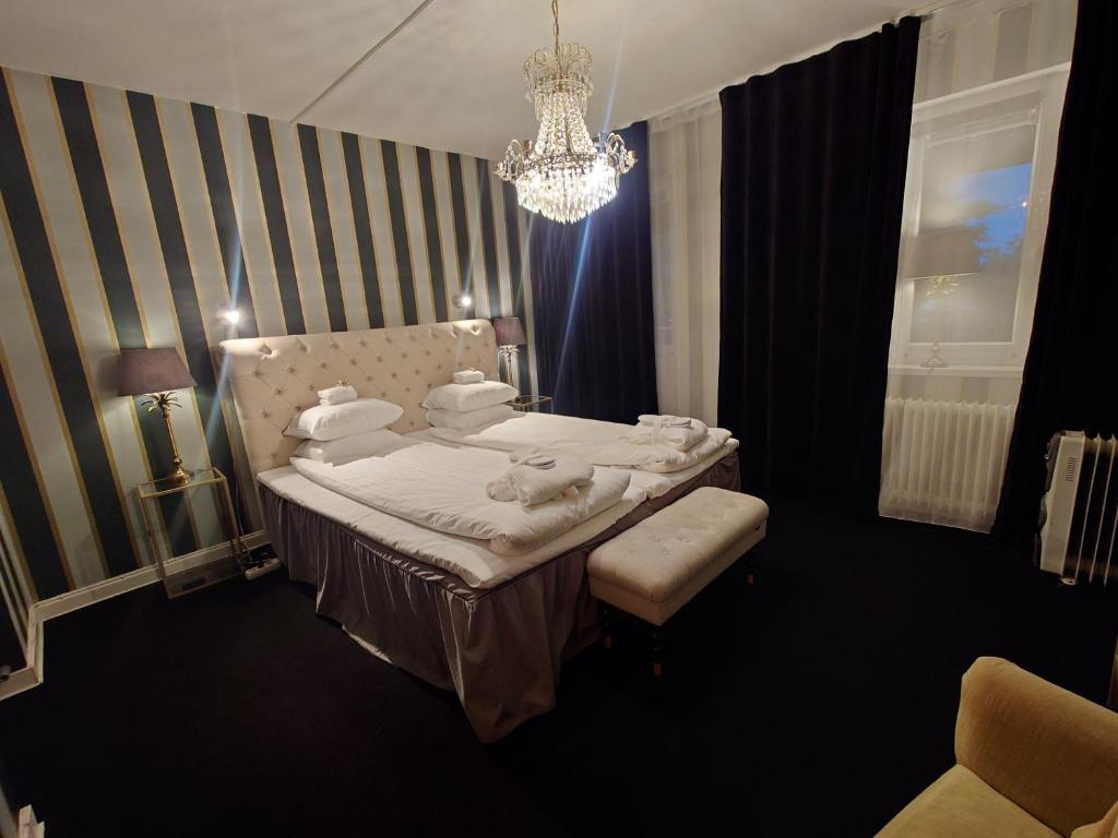 Postel nebo postele na pokoji v ubytování Palace Hotell
