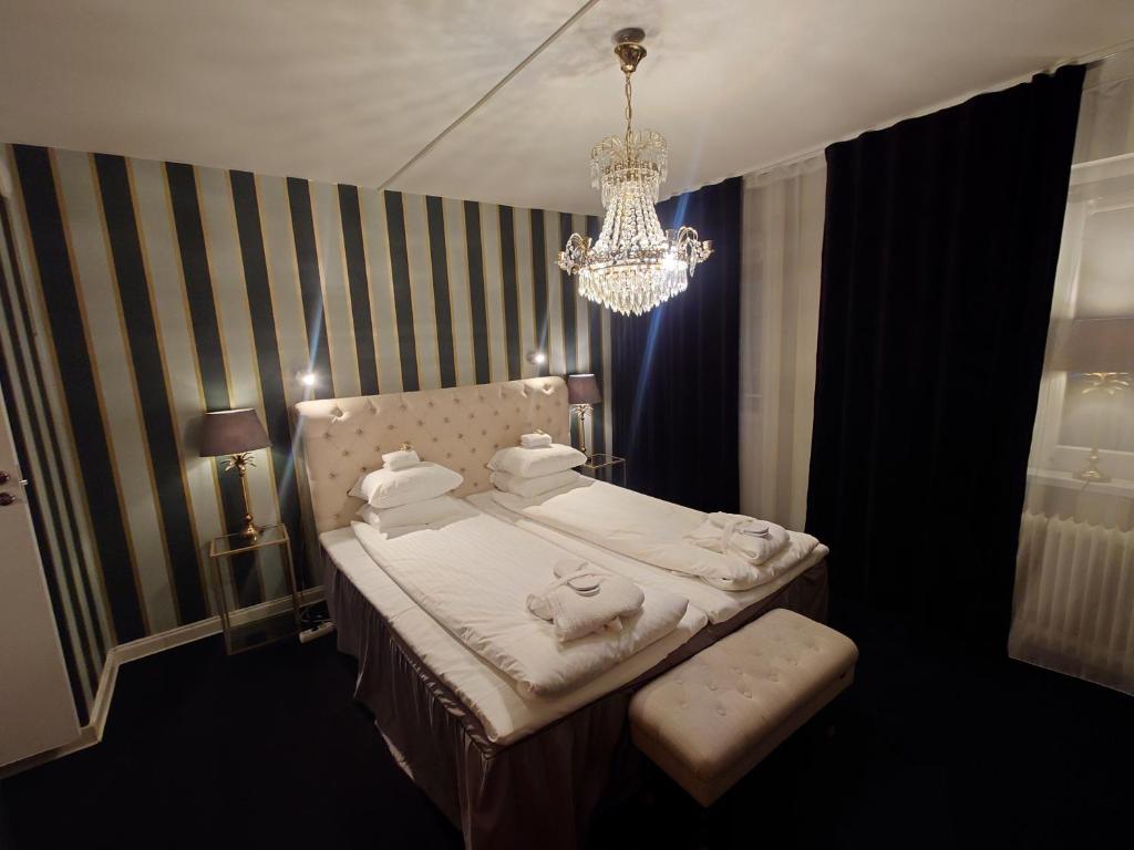Postel nebo postele na pokoji v ubytování Palace Hotell