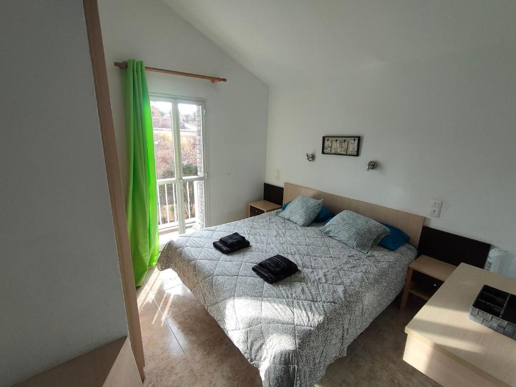Postel nebo postele na pokoji v ubytování MASPALOMAS GREEN OASIS CLUB playa