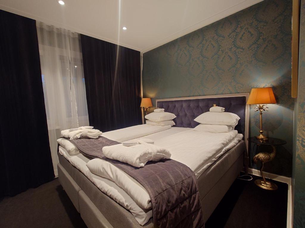 Postel nebo postele na pokoji v ubytování Palace Hotell