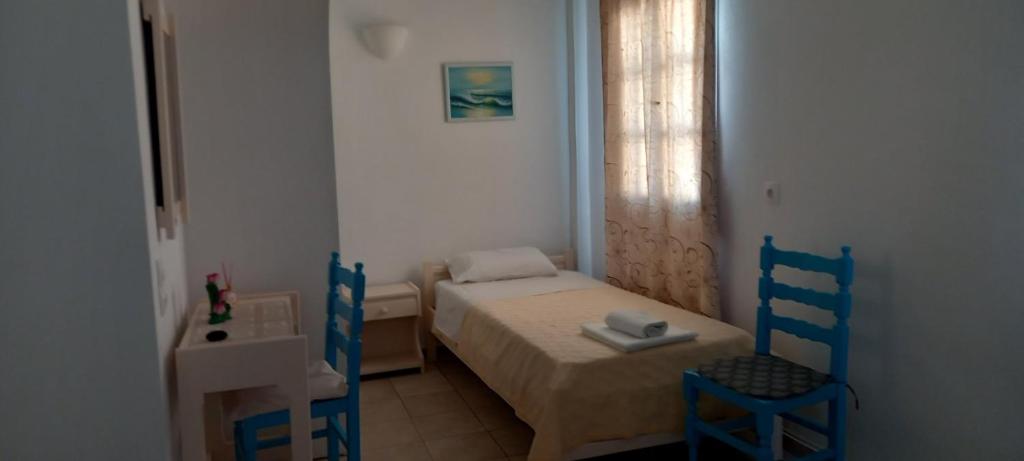 Postel nebo postele na pokoji v ubytování Dimitris Studios