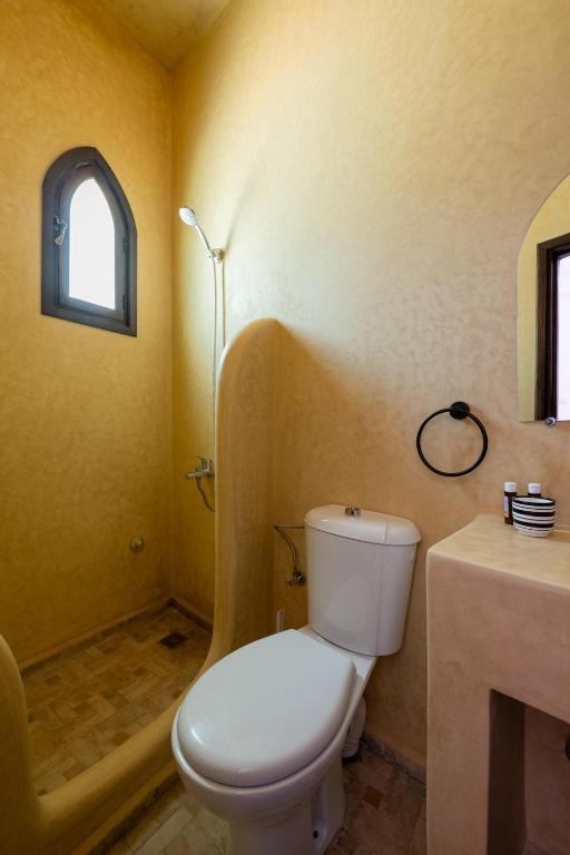 a bathroom with a toilet and a sink at Riad SULTANA in Tangier