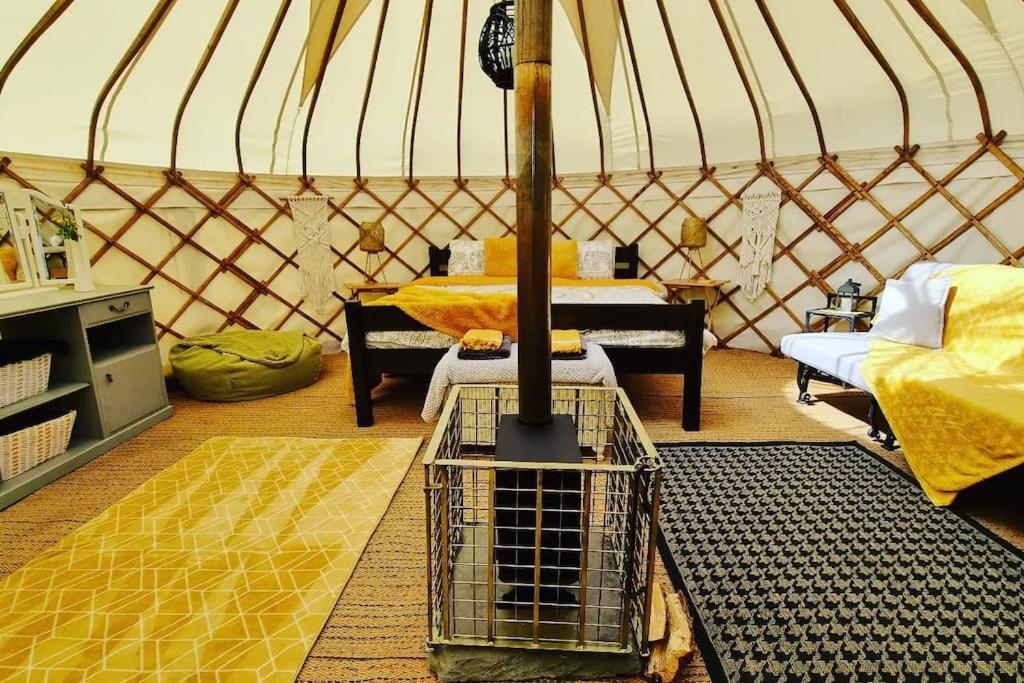 a room with a yurt with a shopping cart in it at Bronfelen Yurt in Cynghordy