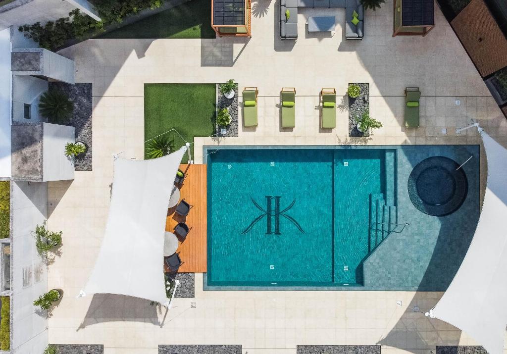 an overhead view of a swimming pool in a building at Adriatika Hotel & Residence in Guatemala